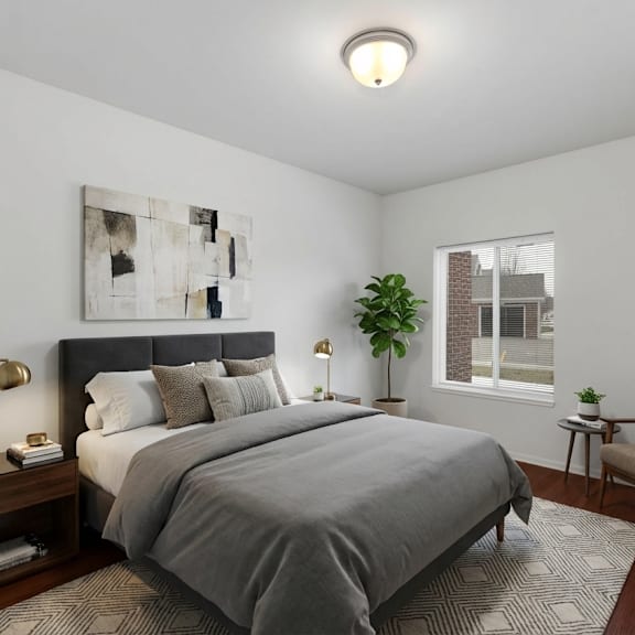 a bedroom with a large bed and a chair.