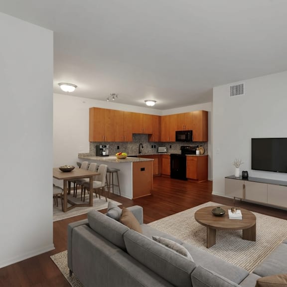 a living room with a grey couch and a wooden coffee table.