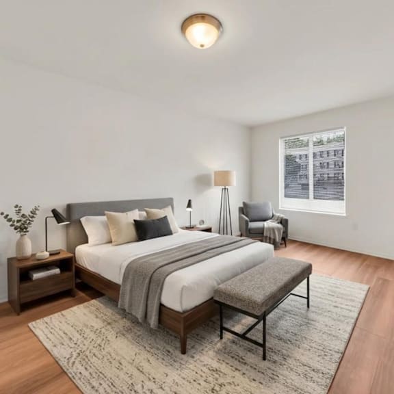 a bedroom with a large bed and a window.