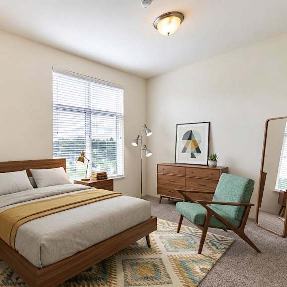 a bedroom with a bed, chair, and a mirror.