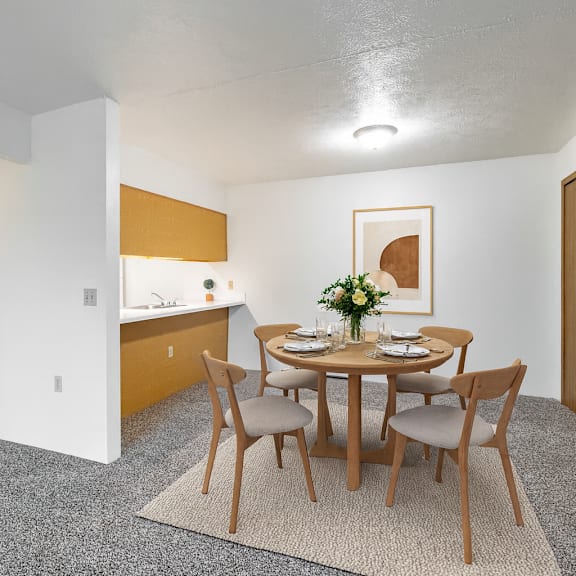 a dining room with a table set for two.