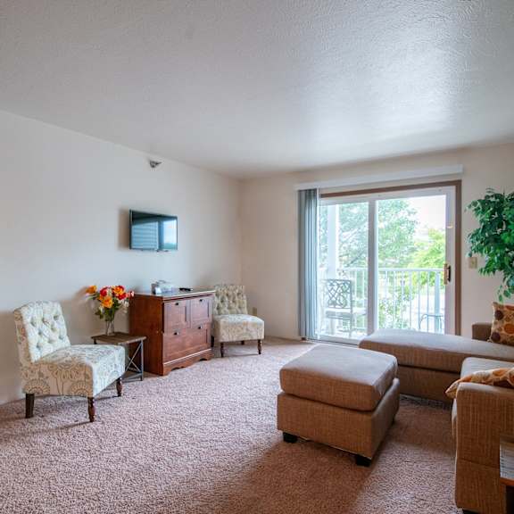 carpeted living room at custer estates apartments, michigan, 48162
