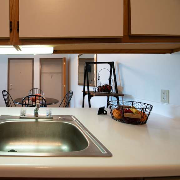 kitchen looking into dining at custer estates in monroe, mi
