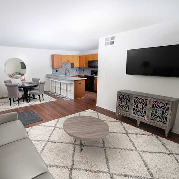 modern living room with television at gray estates  apartments, mrd conventional, st clair mi 48079