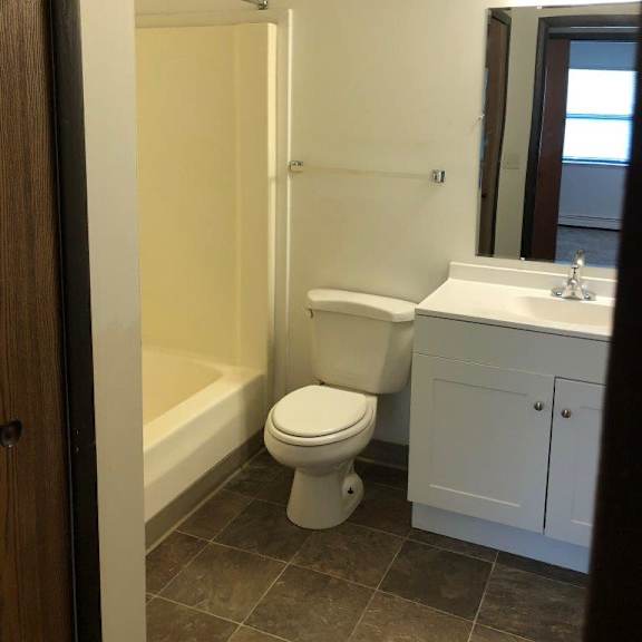 a bathroom with a toilet sink and bathtub