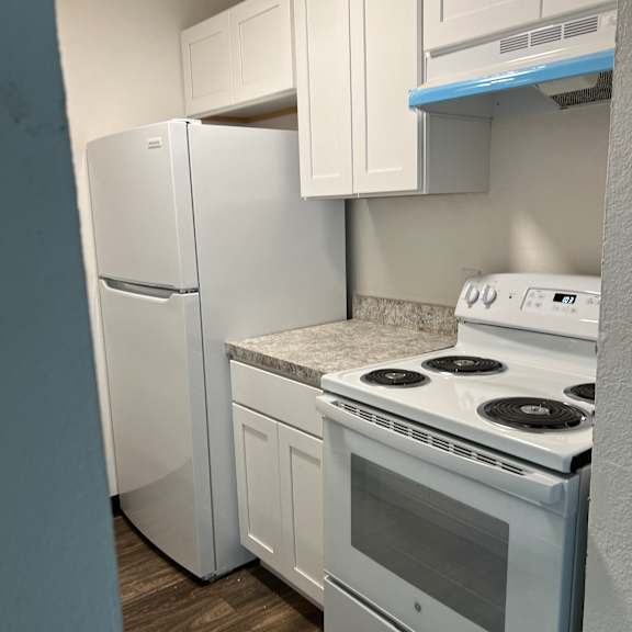 an overhead view of a kitchen with a washer and dryer