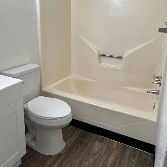 a small bathroom with a toilet and a shower in it