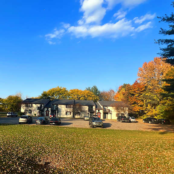 a house with a carport and a lawn in front of it