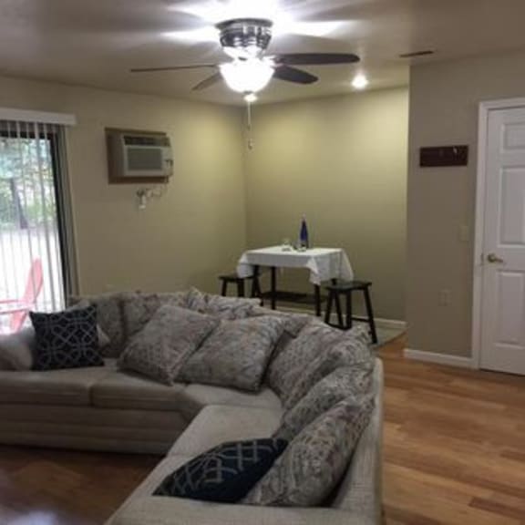 a living room with a couch and a table in the background