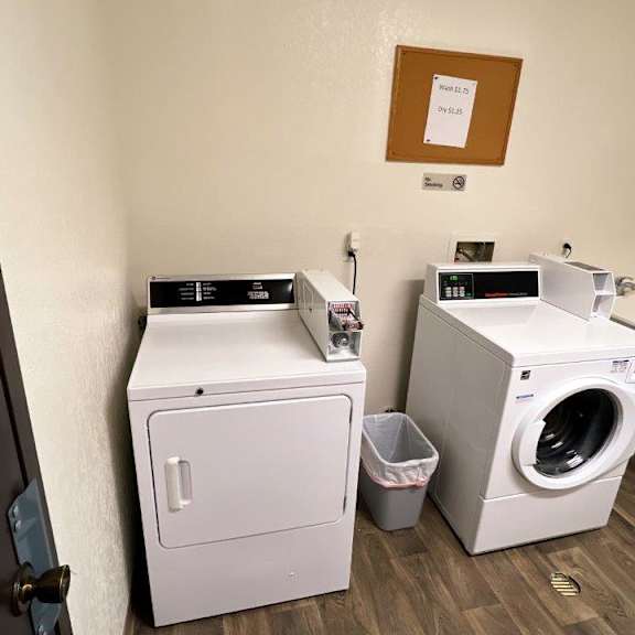 a small laundry room with a washing machine and a dryer