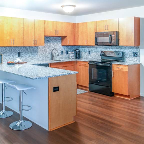fully furnished kitchen at oliver apartments, temperance