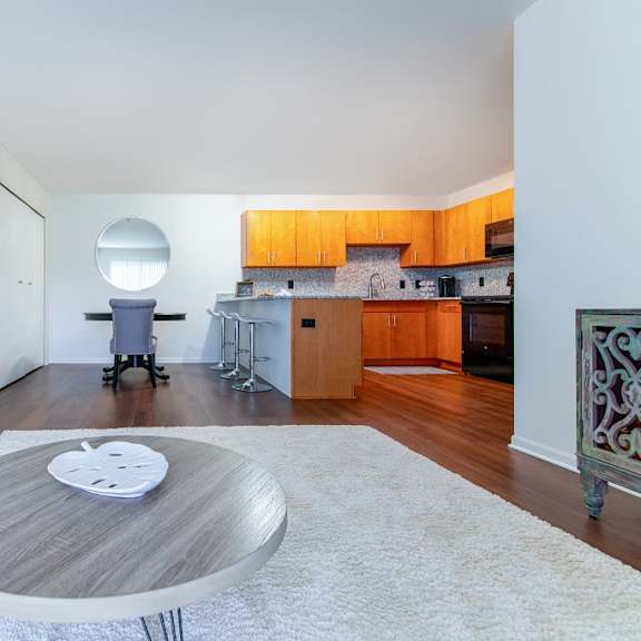 living room with kitchen at oliver apartments, temperance, michigan