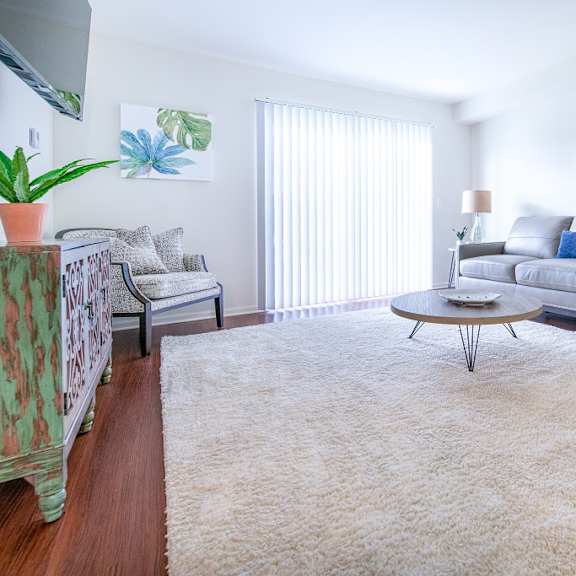 carpeted living area at oliver apartments, michigan