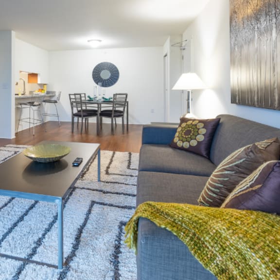 living room at bell estates apartments, michigan