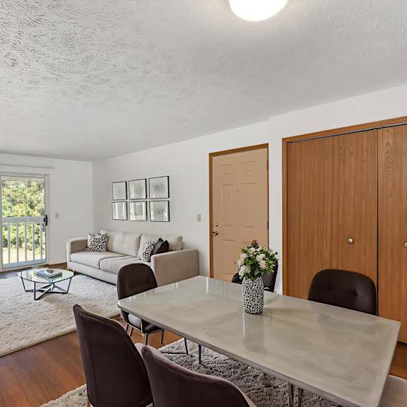 a dining room with a table and chairs.