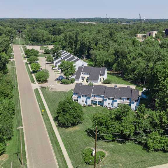 aerial view of lush green property exterior at raleigh house apartments, mrd apartments, michigan