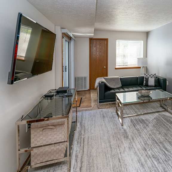 modern living room at raleigh house apartments, mrd apartments, east lansing