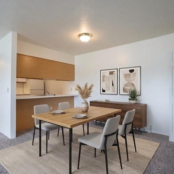 a dining room with a wooden table and chairs.