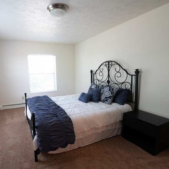 comfortable bedroom at woodbury estates apartments, adrian, michigan