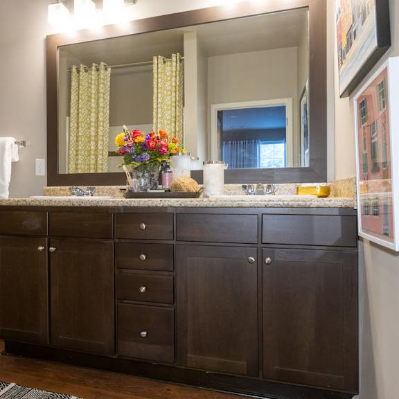 a bathroom with a sink and a mirror and a toilet