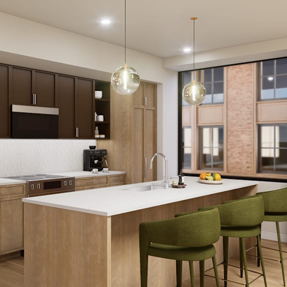 a modern kitchen with a large island and green chairs.