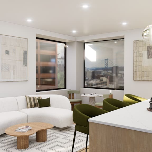 a modern living room with a white sofa, a coffee table, and a kitchen area with a sink.