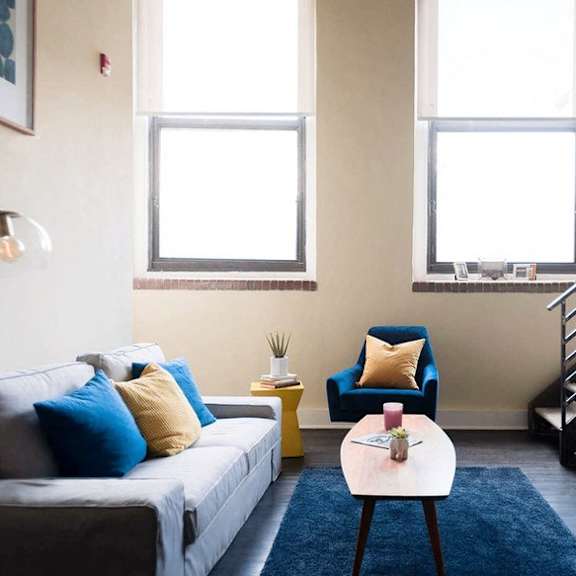 a living room with a couch and a table