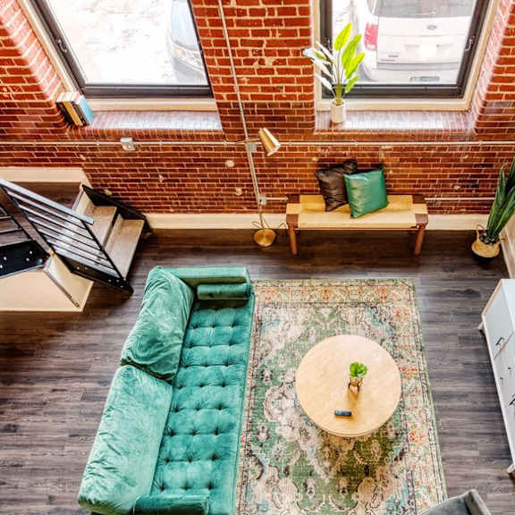 an overhead view of a living room with a couch and a table