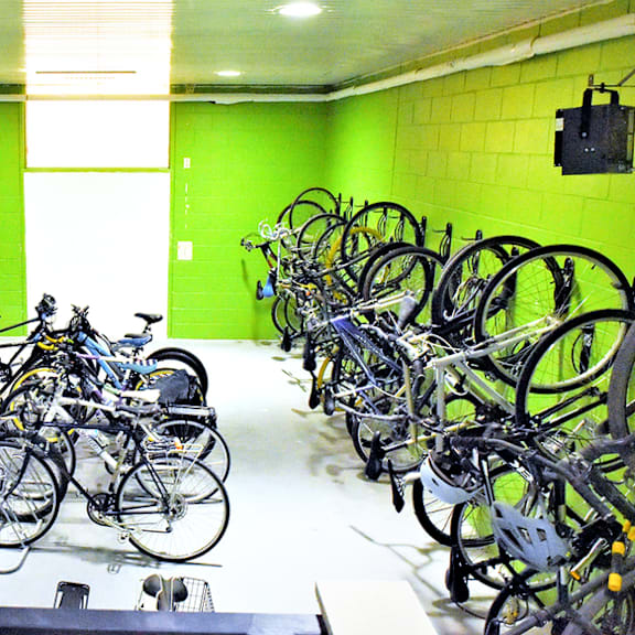 a bunch of bikes parked in a room