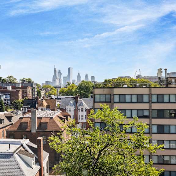 the view of the city from the roof of a building