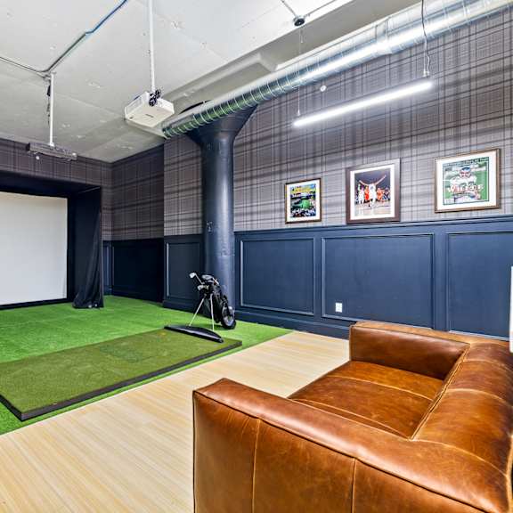 a large room with a couch and a projector