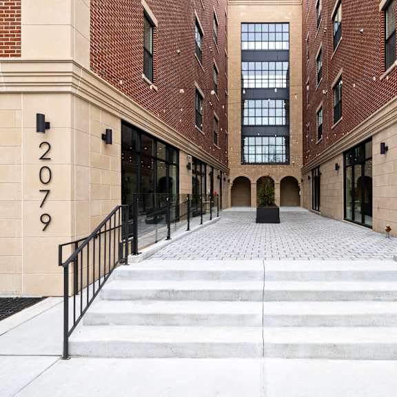 the entrance to a building with stairs in front of it