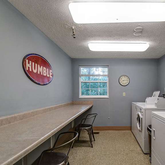 a laundromat with the word "humble" on the wall.