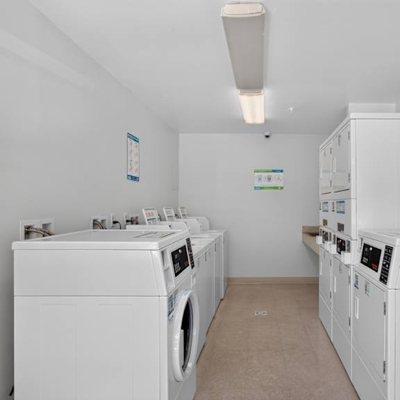a row of washing machines in a laundromat.