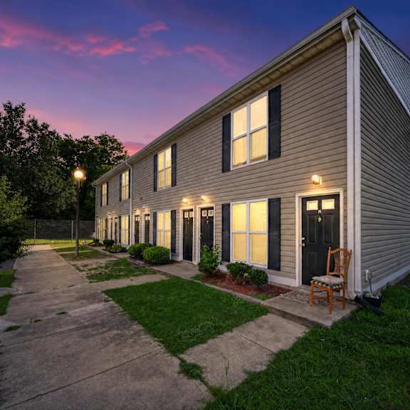 a house with a chair in front of it.