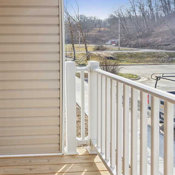 a view of a balcony with a sliding door.