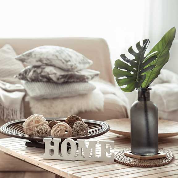 a coffee table in a living room with a plate of cookies on it