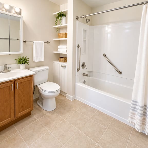 a white bathroom with a toilet, sink, and bathtub.