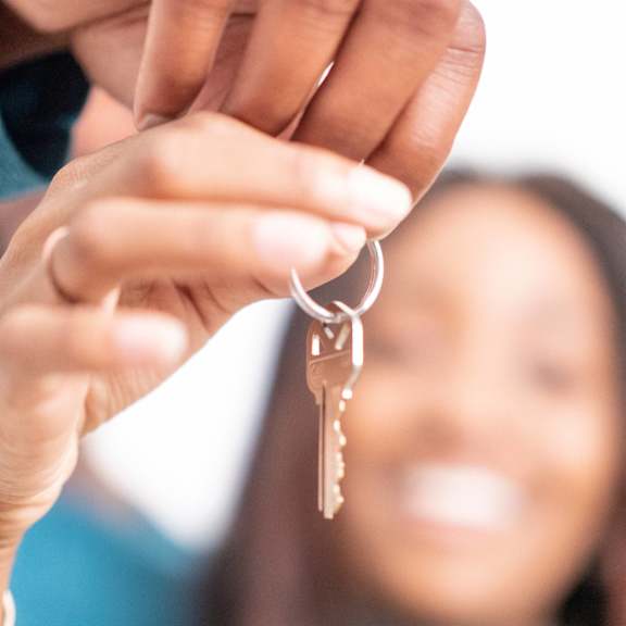 a person is holding a bunch of keys.