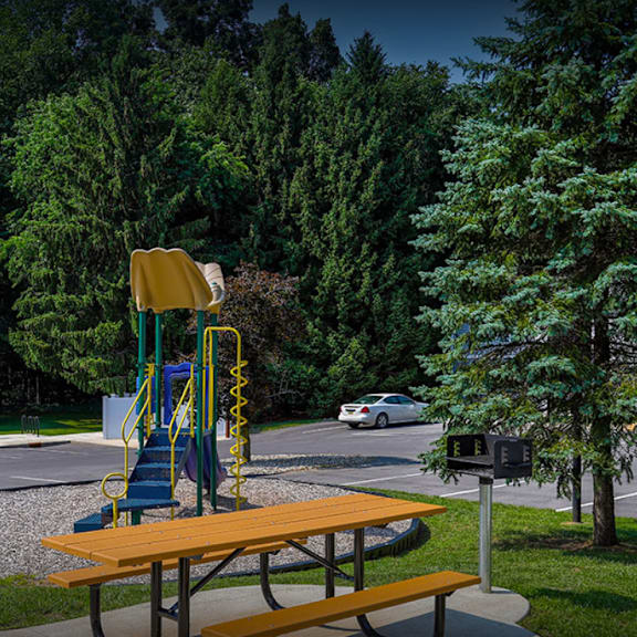 a playground with a picnic table