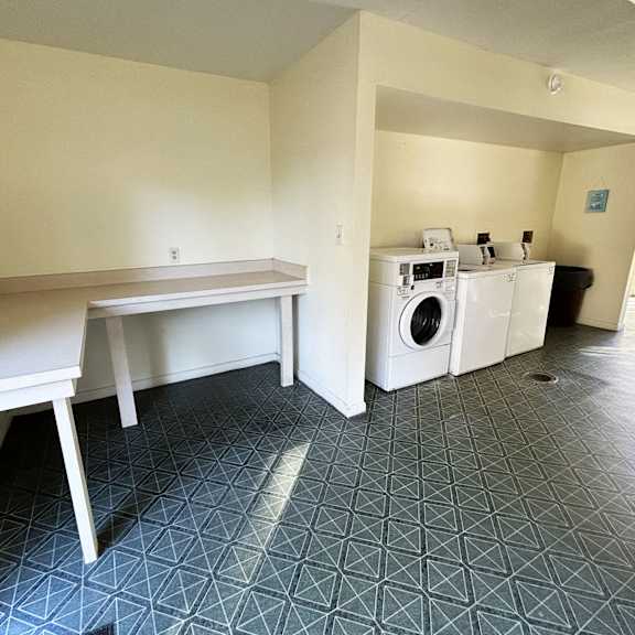 a laundry room with a washer and dryer.