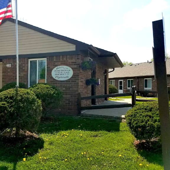 a home with an flag in front of it