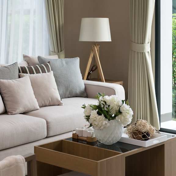 a living room with a white couch and a coffee table