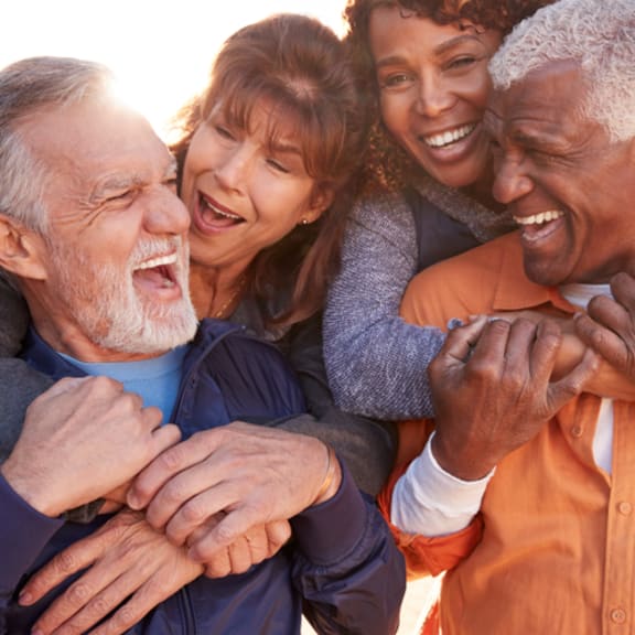 a group of people with their arms around each other