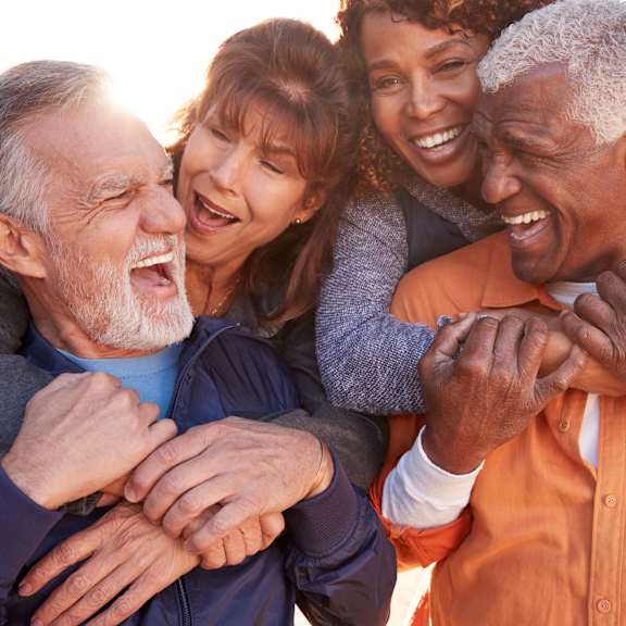 a group of people with their arms around each other