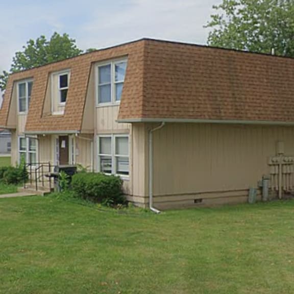 a house with a yard in front of it