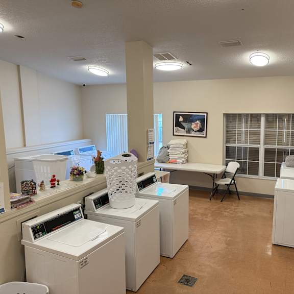 a laundry room with washers and dryers.