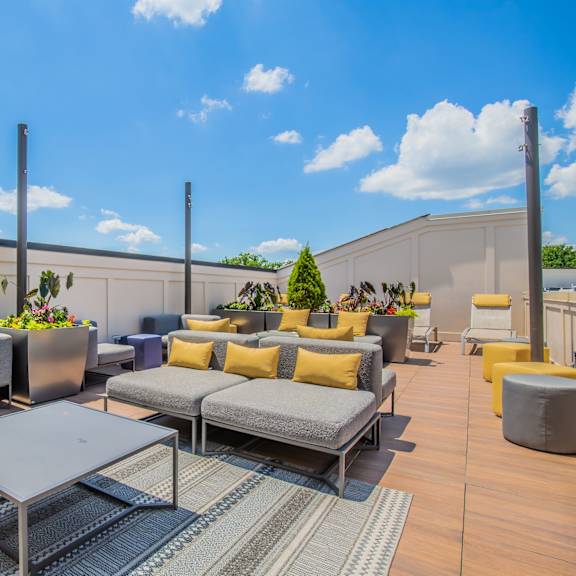 A patio with a table and chairs.