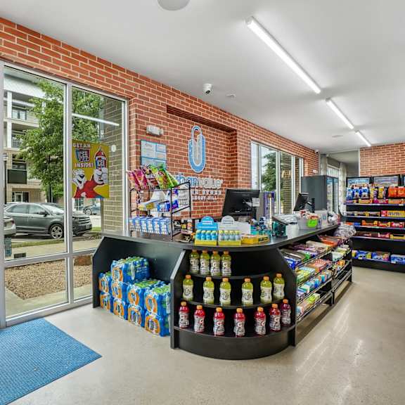 a store with a blue mat in front of the entrance.