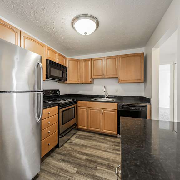 upgraded kitchen with stainless steel appliances and marble countertops